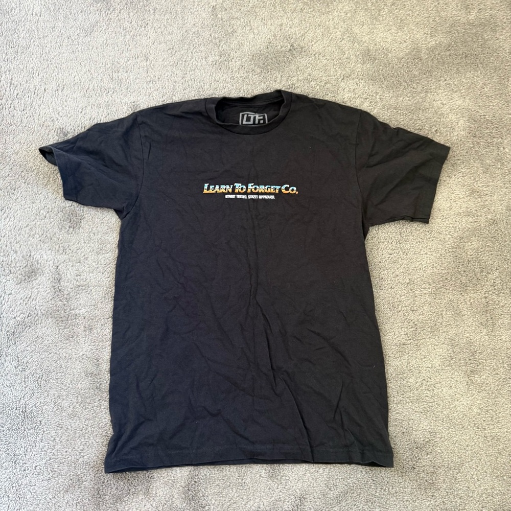 LEARN TO FORGET GO. LOGO GRAPHIC TEE